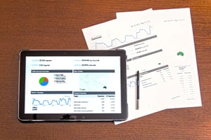 Computer and papers with analytics